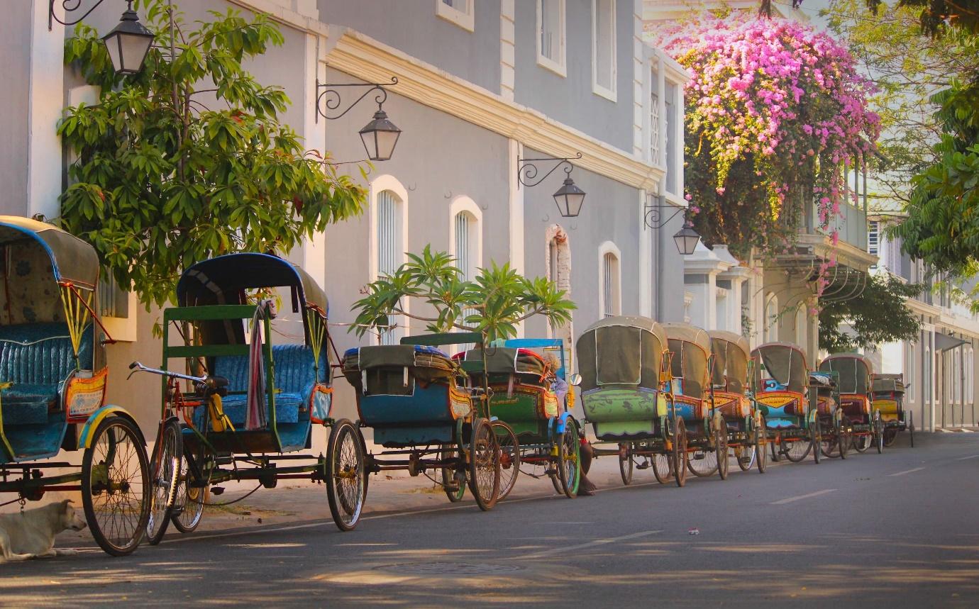 Multiple buggy cycles parked on a pavement in Pondicherry | Wedifys Weddings