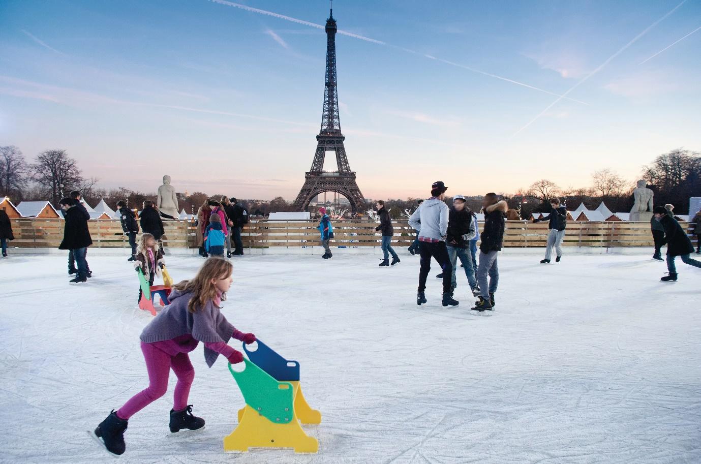 Kids along with adults skating in Trocadéro Gardens with a magnificent view of the Eiffel Tower | Wedifys