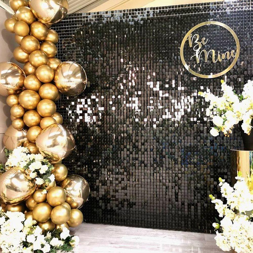 Glitter backdrop wall decorated with balloons and some flowers | Wedifys