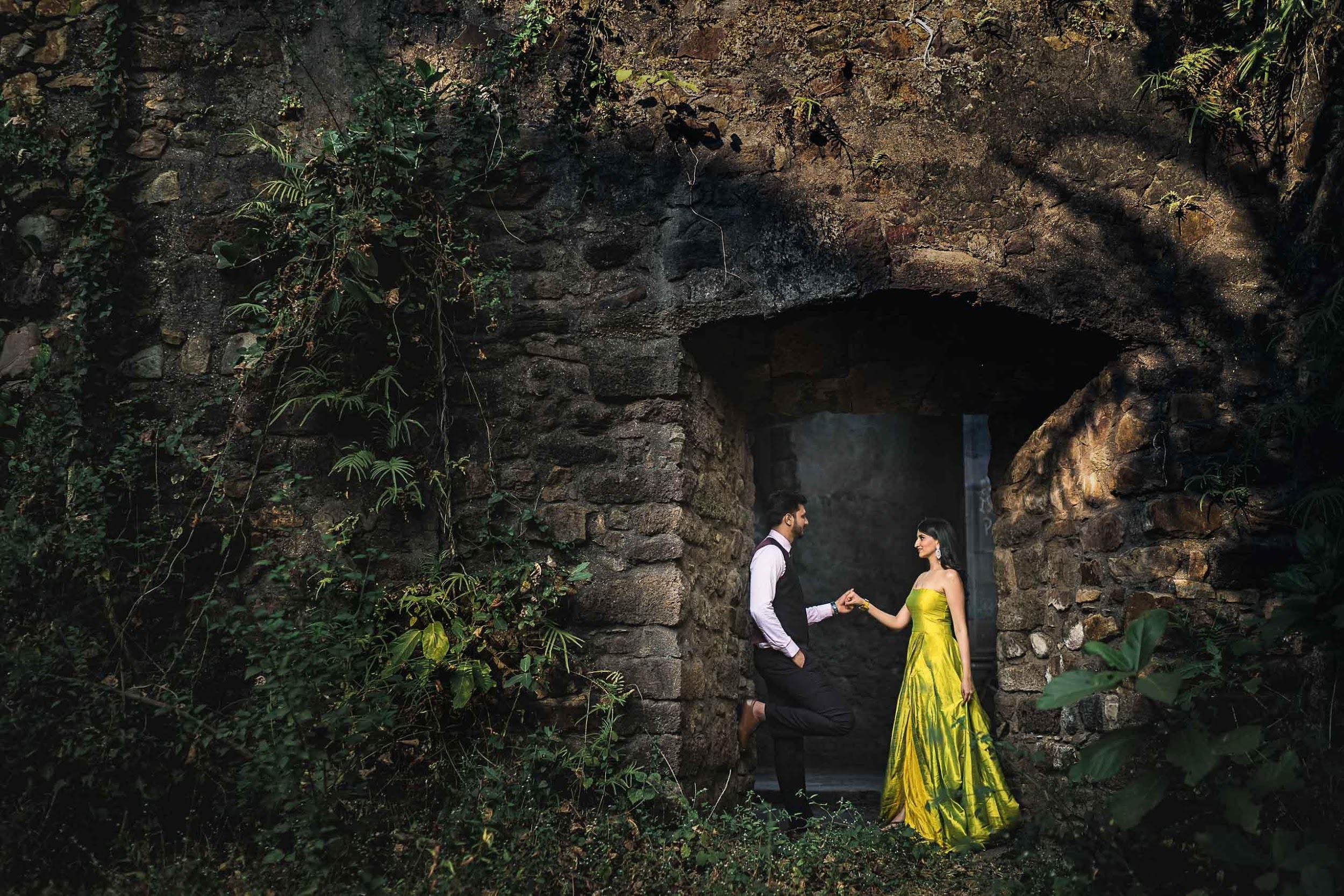 a couple standing in the Vasai Fort posing for a photoshoot | Wedifys