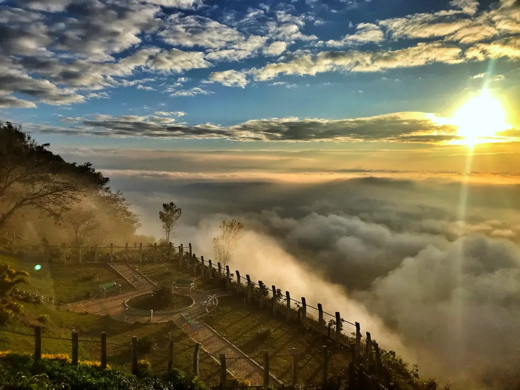 Nandi Hills above the clouds with scenic sunset | Wedifys