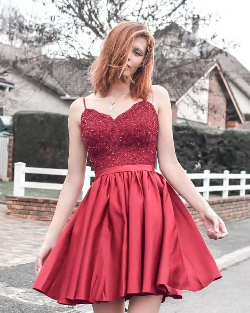 a woman wearing a red cocktail dress | Wedifys