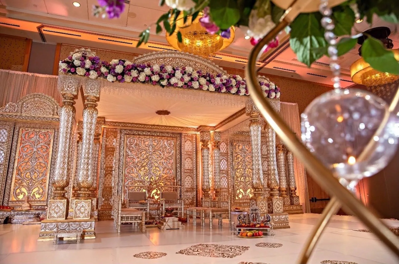 modern style mandap decorated in gold and florals | Wedifys