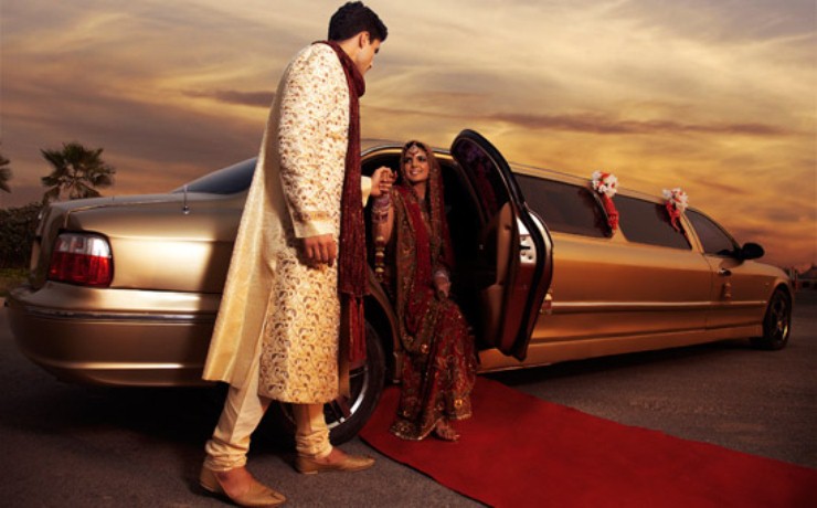 Indian bride and groom on their way to the wedding in a luxury limo car | Wedifys