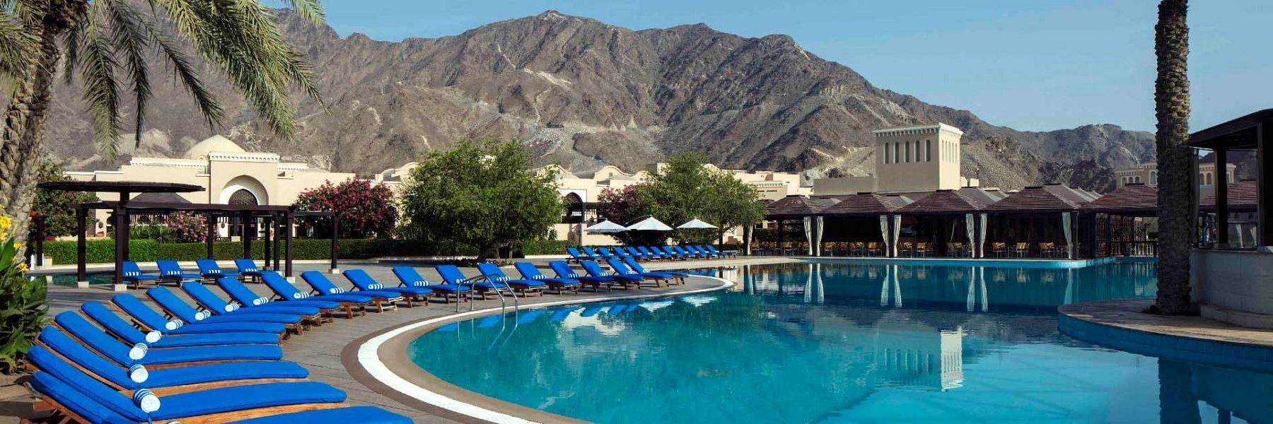 Majestic Hajar Mountains in the backdrop of Al Aqah Beach Resort | Wedifys