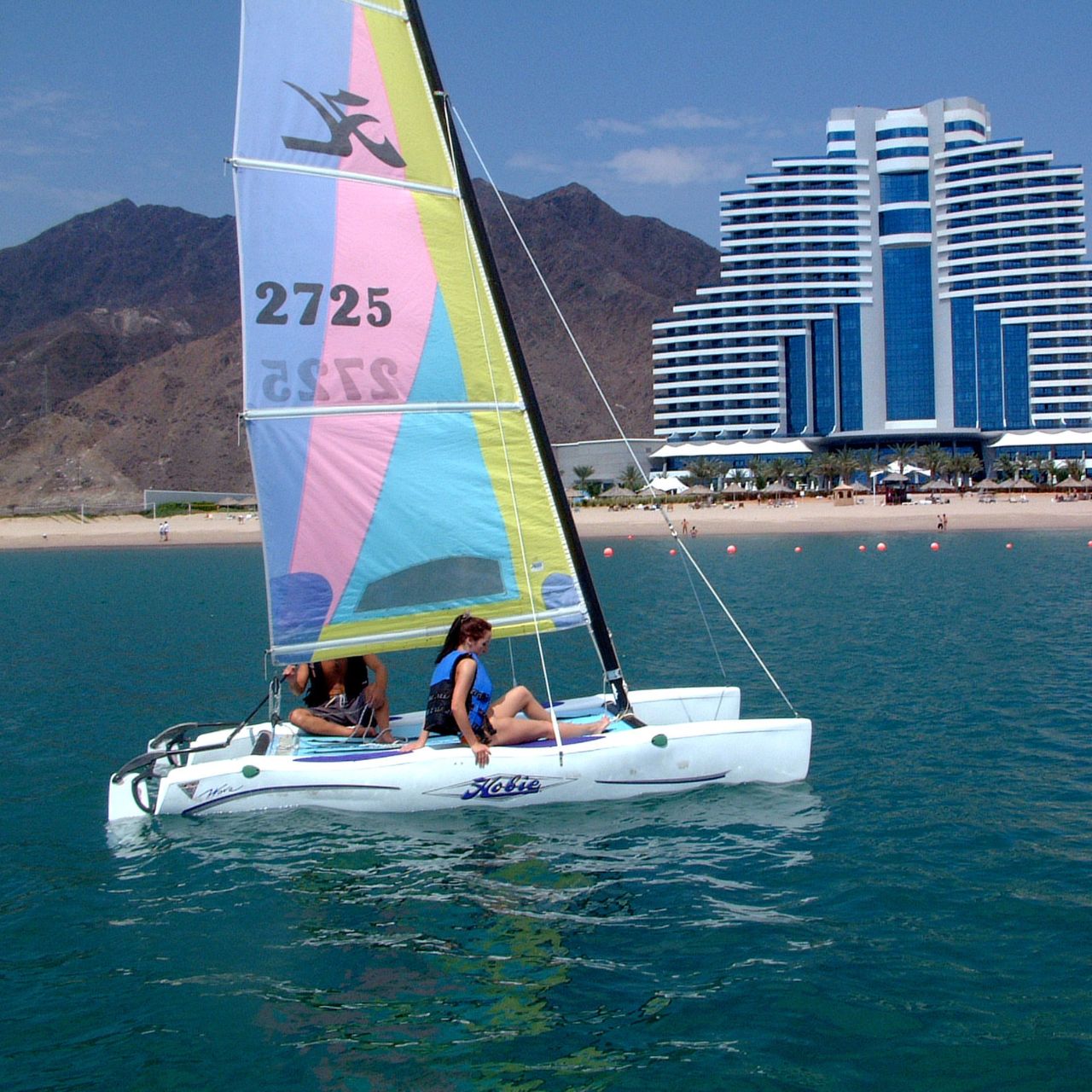 sailing at the beach at Le Meridien Al Aqah Resort | Wedifys