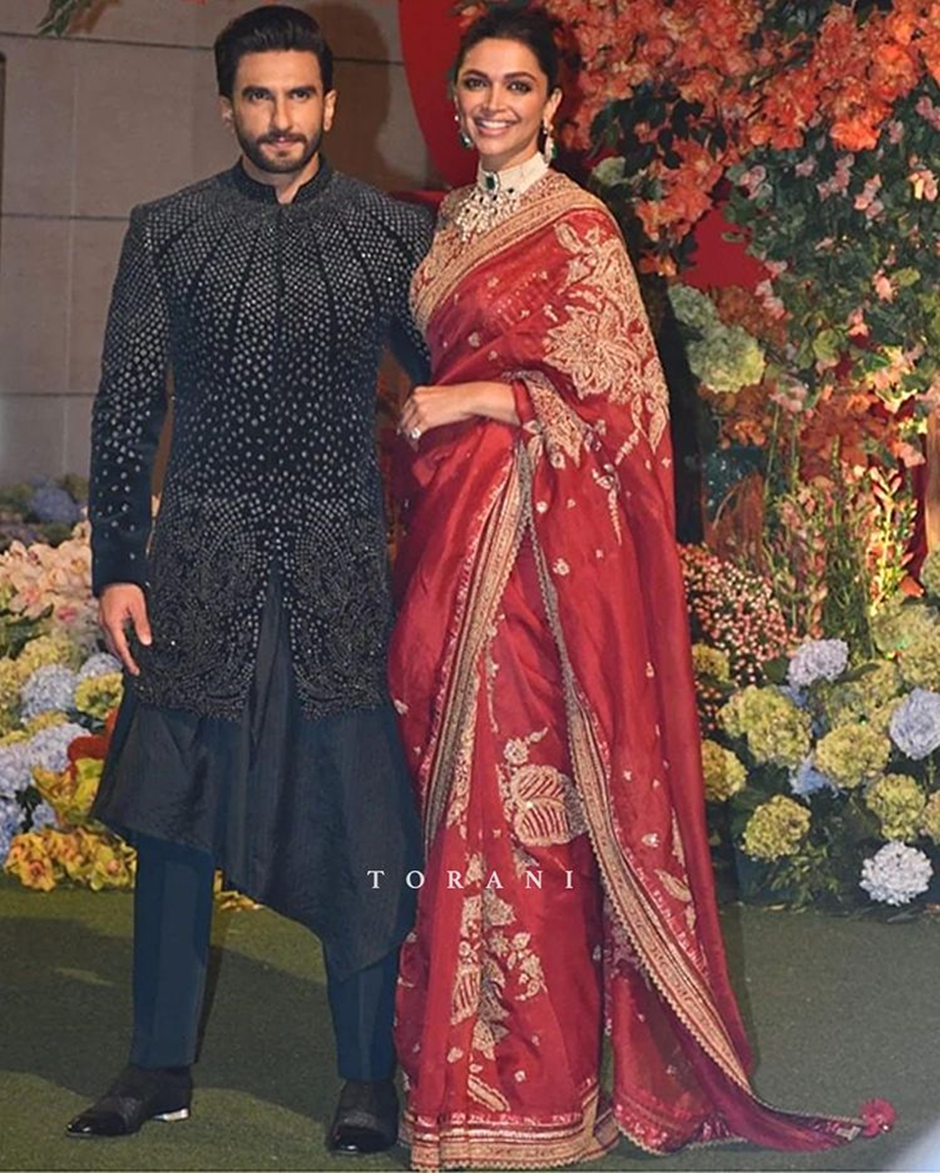 At the Ambani bash, Deepika Padukone captivated everyone in a stunning Sindoori Taashi sari by Torani, designed by Karan Torani. | Wedifys