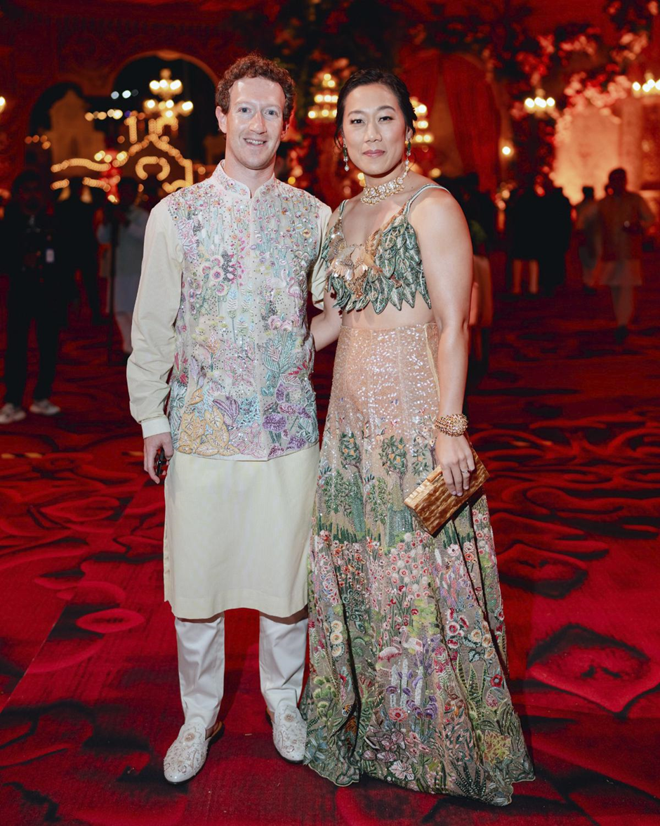 This photograph released by the Reliance group shows Mark Zuckerberg and his wife Priscilla Chan posing for a photograph at a pre-wedding bash of Mukesh Ambani’s son Anant Ambani` in Jamnagar | Wedifys