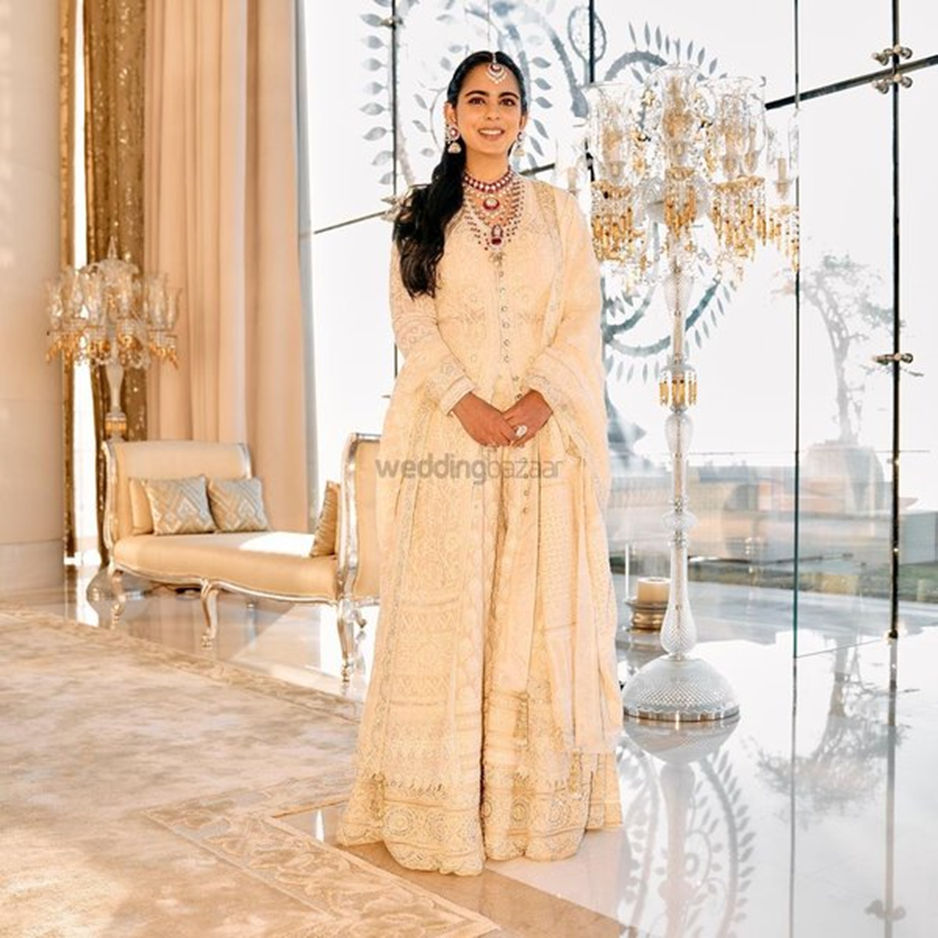 Isha Ambani Piramal looked as radiant as ever in her chikankari lehenga Abu Jani Sandeep Khosla paired with a lovely sherwani and dupatta. | Wedifys