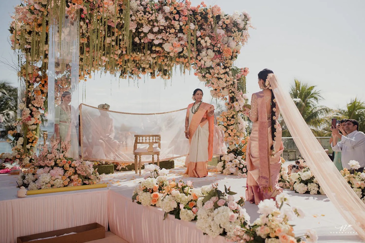 mandap decorated with soft blooms and tendrils | Wedifys