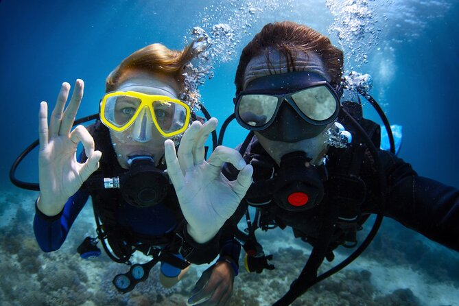 a couple scuba diving in the waters of Balearic, Spain | Wedifys