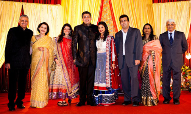 Sameer and Madhuri with guests at their wedding | Wedifys