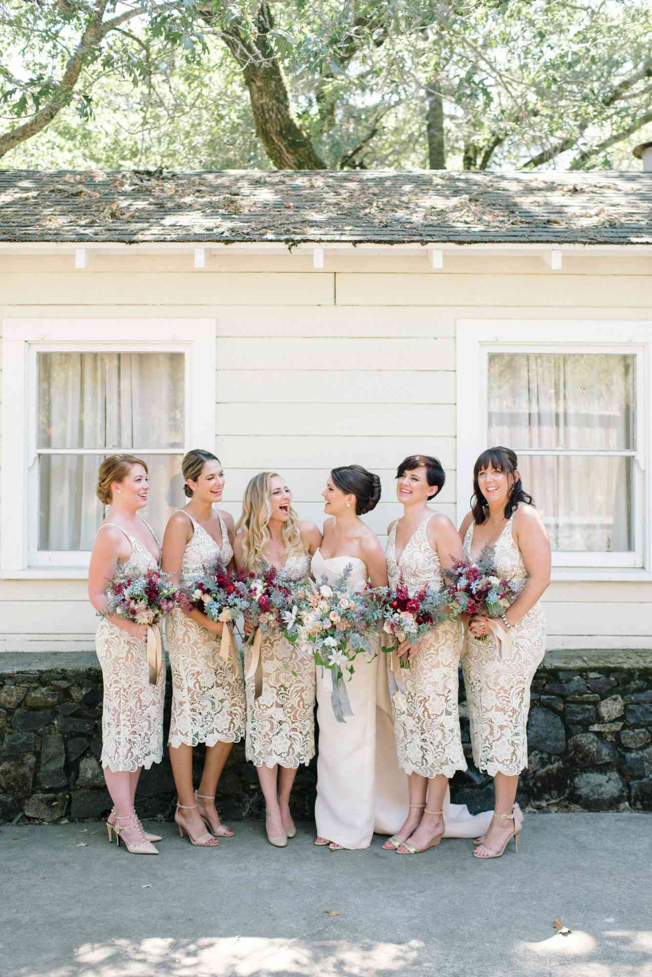 bridesmaids wearing lace gowns | Wedifys