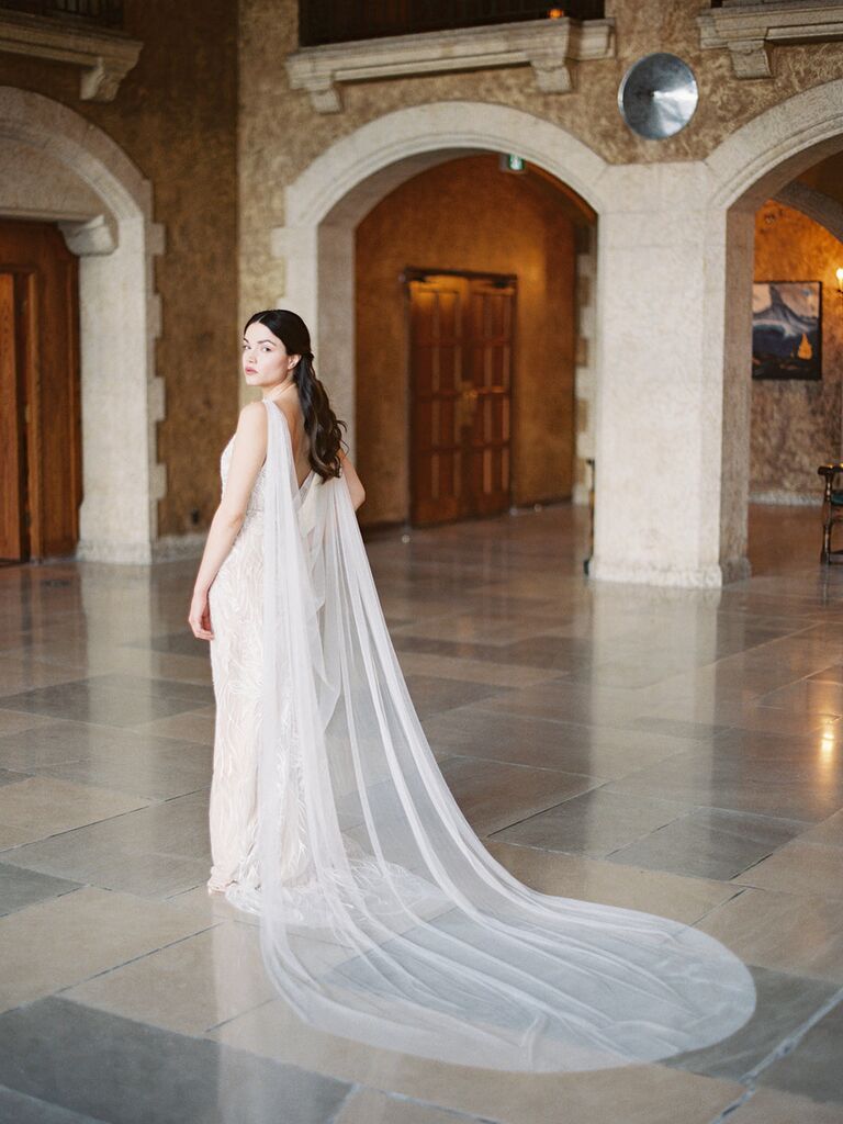 a woman wearing a bridal cape | Wedifys