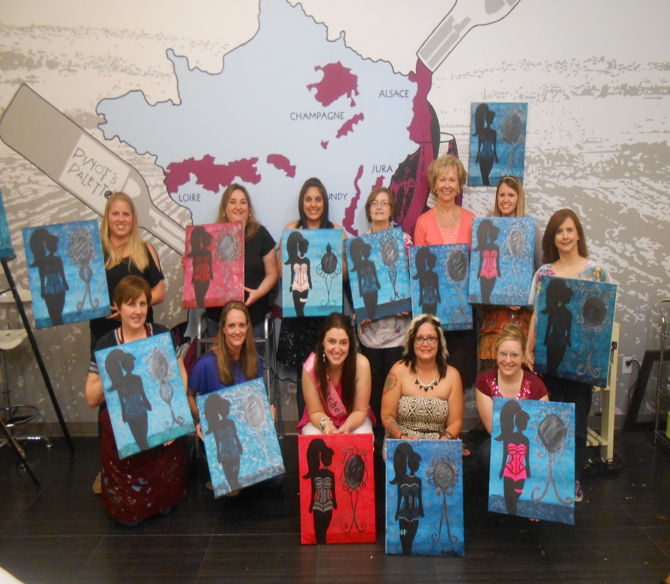 women playing the paint and sip game at a bachelorette party | Wedifys