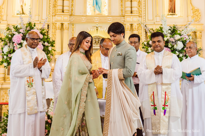 Joe and Madhu at their engagement ceremony at a church in Kochi | Wedifys