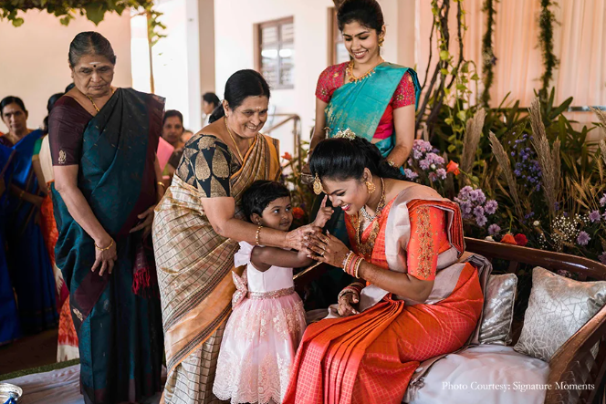 Sangamithira in her engagement with her guests | Wedifys