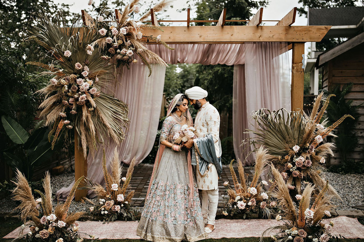 a couple in their wedding with a bohemian wedding décor | Wedifys