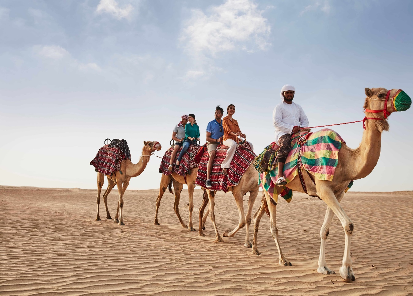 tourists for a camel ride in the Dubai Desert | Wedifys