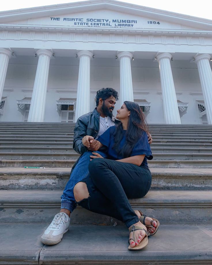 a couple in their pre-wedding photoshoot at the Asiatic Library | Wedifys